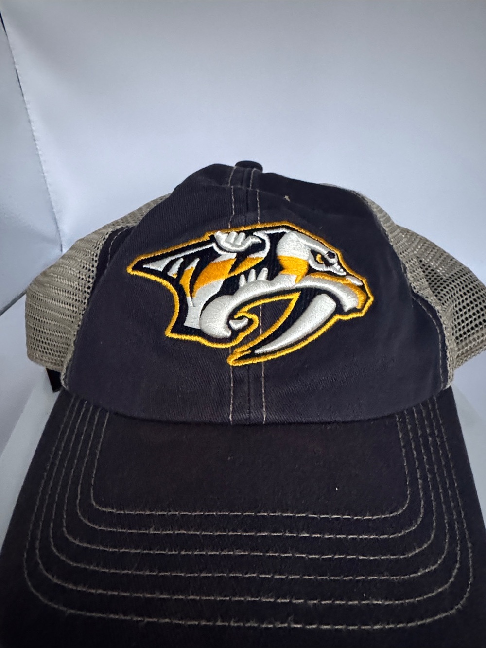 Black and Gold Mesh Back Trucker Hat with Team Emblem Nashville Predators NHL